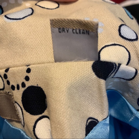 I.e. Tan trench coat with Mod circle design. - Picture 8 of 8